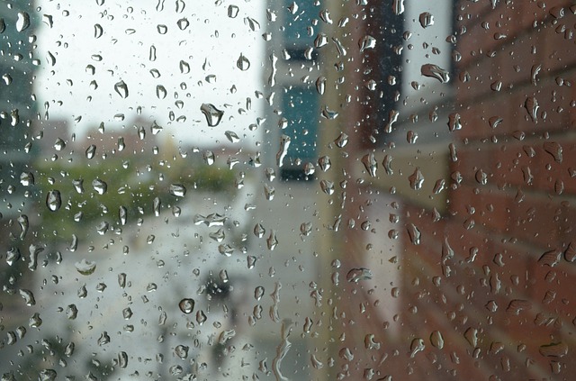 Rain drops on the window as we look outside